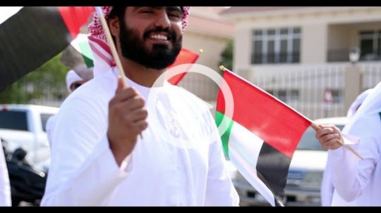 Arab men during a National Day parade celebrating their country|
