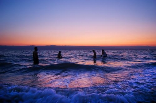 sunrise over the dead sea with waves motion in blur