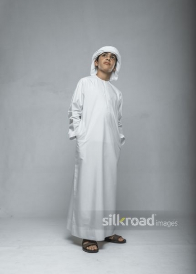 Young Arab boy dressed in the traditional attire|