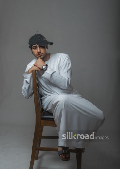 Young man posing on the chair |