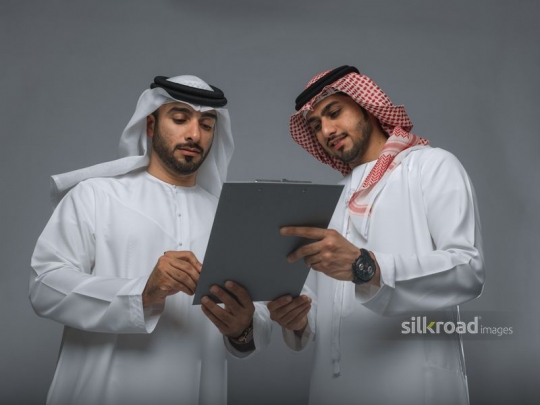 Arab Businessmen working together|