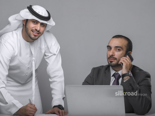 Arab colleagues working together|