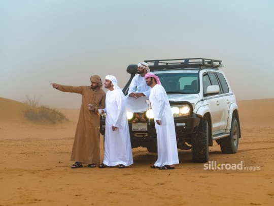 Young men meeting in the desert
