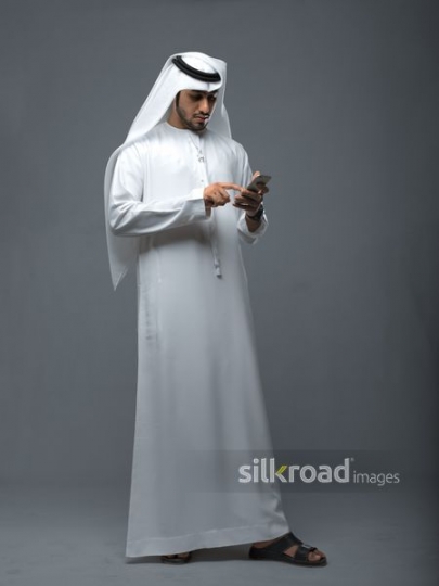 Arab Businessman texting |
