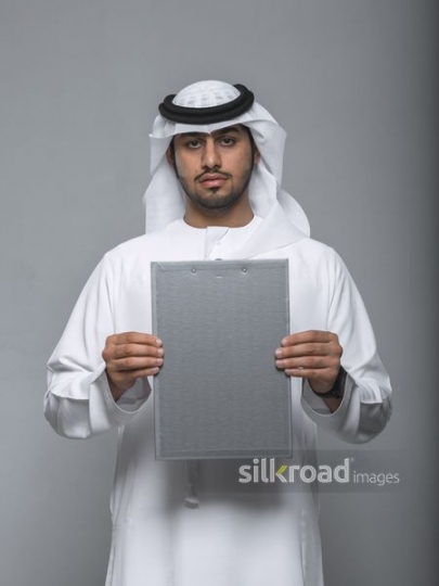 Businessman posing with files|