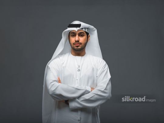 Middle Eastern man arms crossed|-