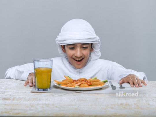 Young boy excited over the food
