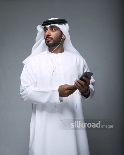 Middle Eastern Businessman using his phone |