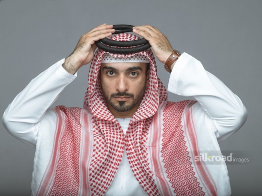 Businessman adjusting his ghutra