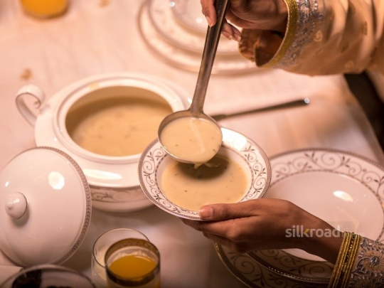 Serving mushroom soup|-