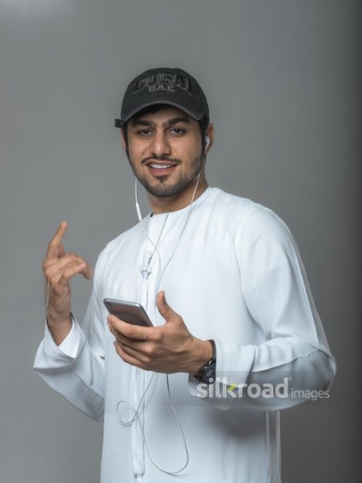 Middle Eastern man posing wearing a hat|