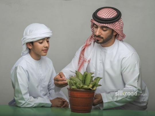Man talking about plants with son