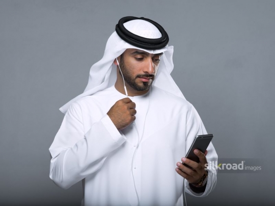 Middle Eastern Businessman talking on the phone|