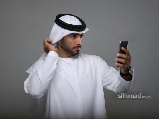 Arab man taking a selfie