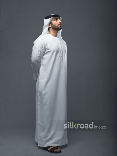 Middle Eastern Businessman dressed in the traditional UAE attire|