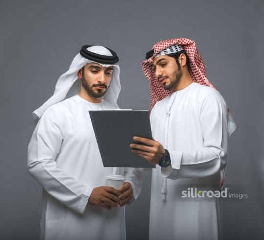 Employees discussing work together|