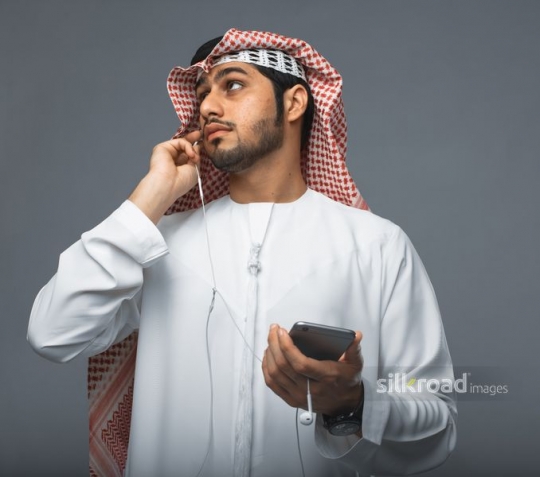Middle Eastern Businessman talking on the phone|