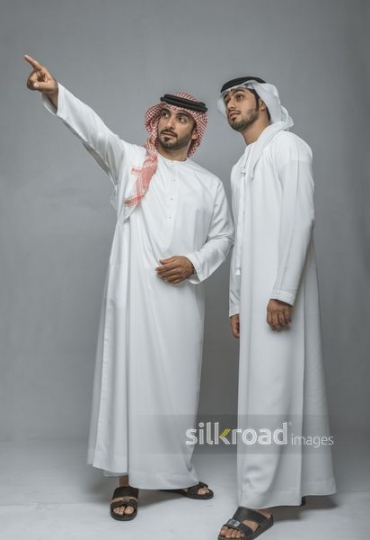 Man drawing the attention of his friend