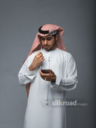 Arb man talking on the phone|