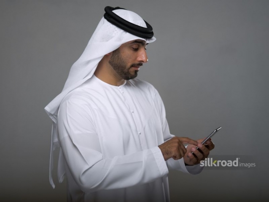 Arab man texting