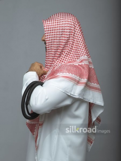 Arabian man fixing his head cover