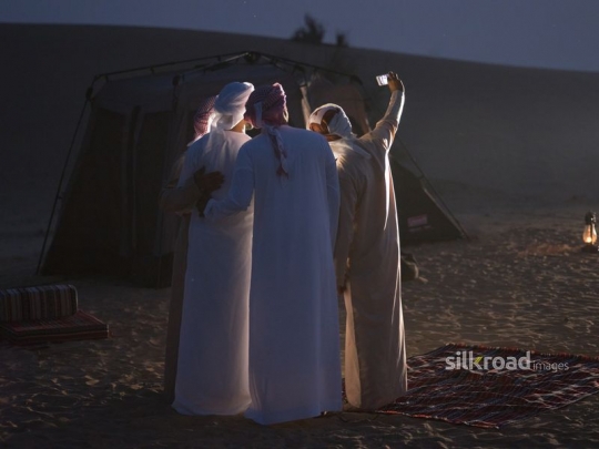 Friends taking selfie in the evening