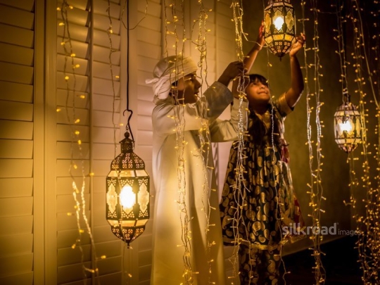 Girl and boy  fixing ornaments|-