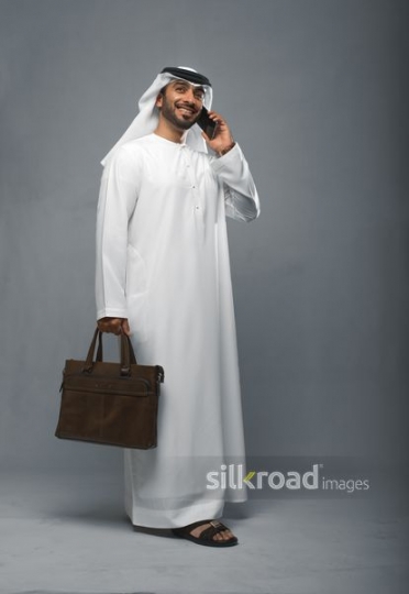Arabian businessman speaking over the phone