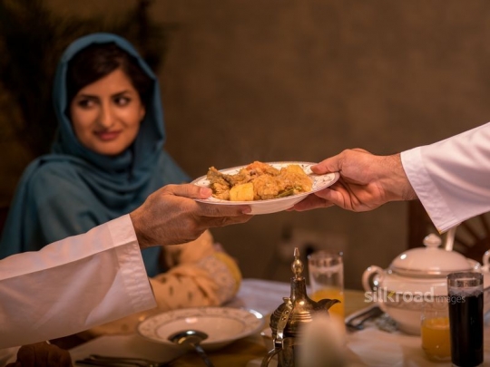 Serving a tradtional meal|-