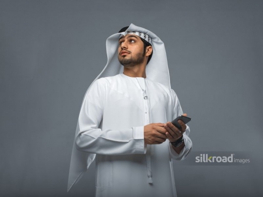 Arabian mann looking up|
