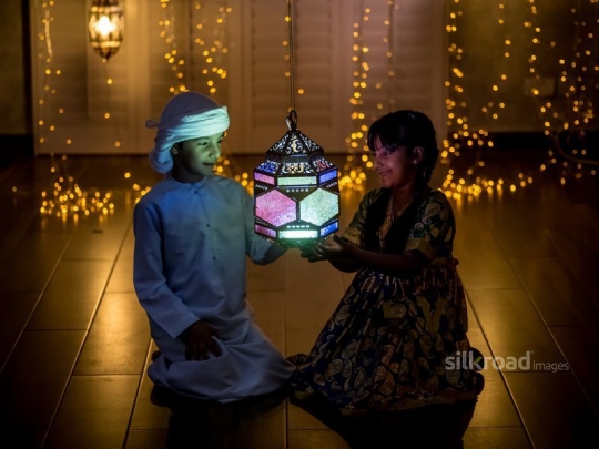 Brother and sister with lantern|-