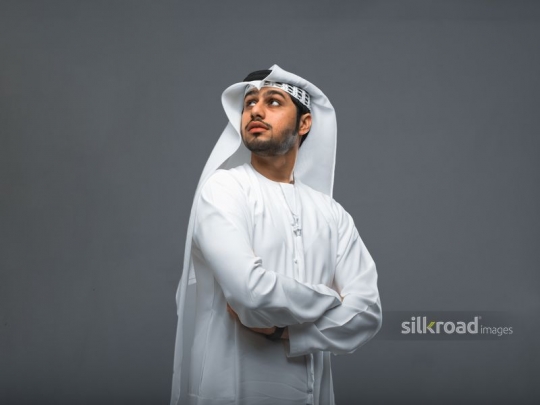 Middle Eastern man arms crossed|