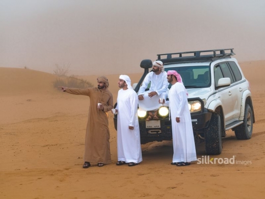 Friends taking a break in the desert