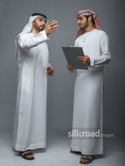 Middle Eastern Businessman talking to his colleague |