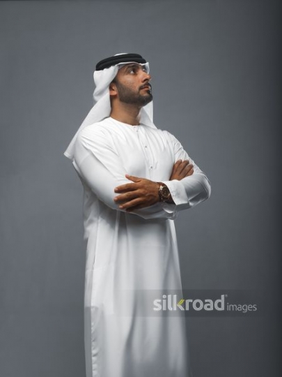 Middle Eastern man arms crossed|
