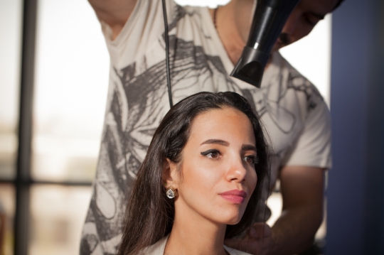 Woman getting a blow dry at the hair salon|