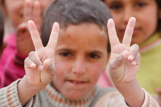 kid showing victory sign
