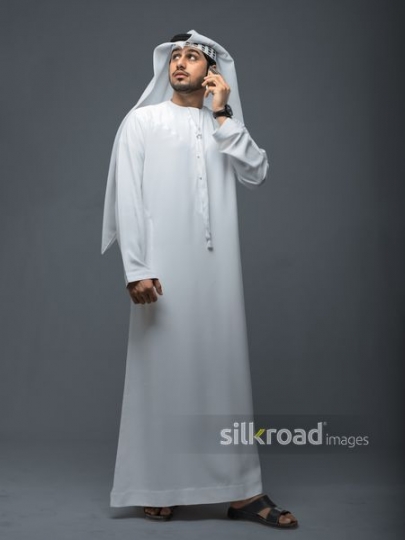 Middle Eastern Businessman talking on the phone|