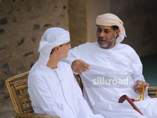 Old man in conversation with boy|-