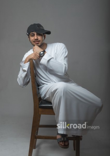 Middle Eastern man sitting on the chair|