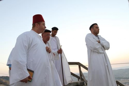 members of the Samaritan community march atop Mount Gerizim, above the West Bank city of Nablus,