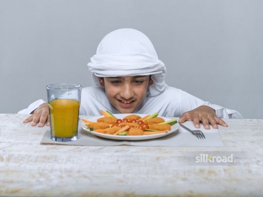 Boy happily looking at plate