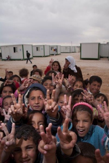 group of kids showing V sign from Zaatari refugee camp for Syrian refugees