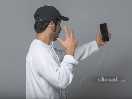 Middle Eastern man taking a selfie