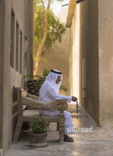 Arab man sitting on the bench|-
