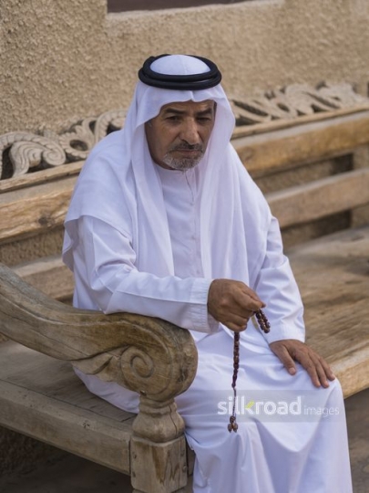 Arab man sitting with his misbahah in his hand |-