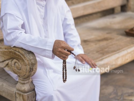 Close up of a man with his misbaha|-
