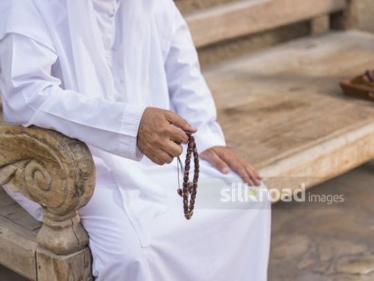 Man with his misbaha in his hand|-