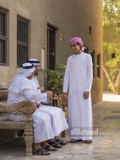 Arab men talking to each other|-