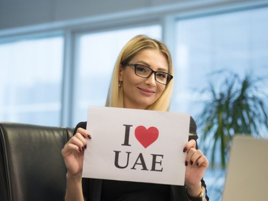 Western woman celebrating National Day at the office|